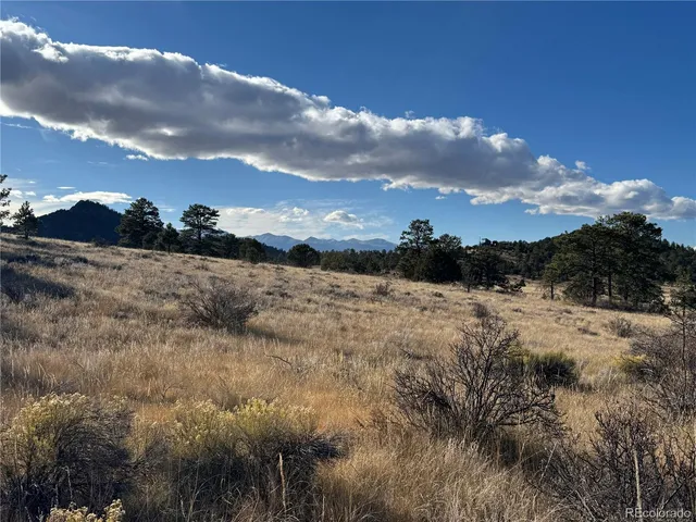a view of a lake in between two of trees