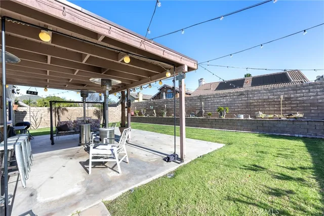 a view of a backyard with sitting area