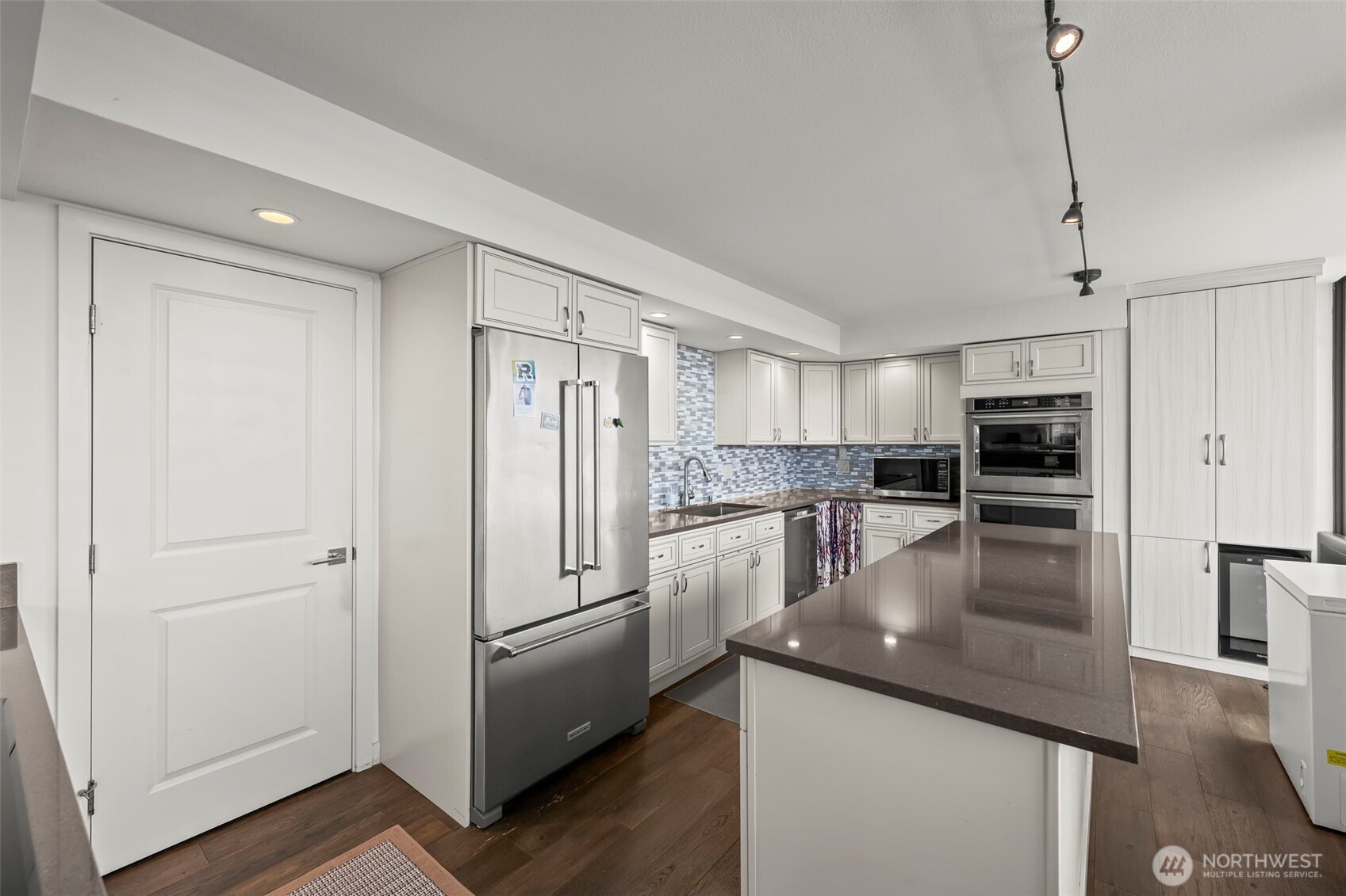 1 North Stadium Way, Unit 2 Tacoma, WA 98403 - Photo 17 of 40 a kitchen with stainless steel appliances granite countertop a refrigerator a stove and a sink
