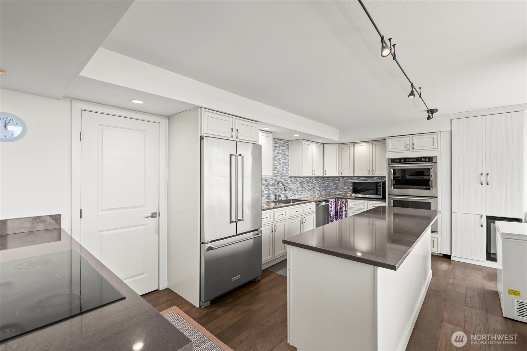 1 North Stadium Way, Unit 2 Tacoma, WA 98403 - Photo 19 of 40 a kitchen with stainless steel appliances granite countertop a refrigerator and a sink