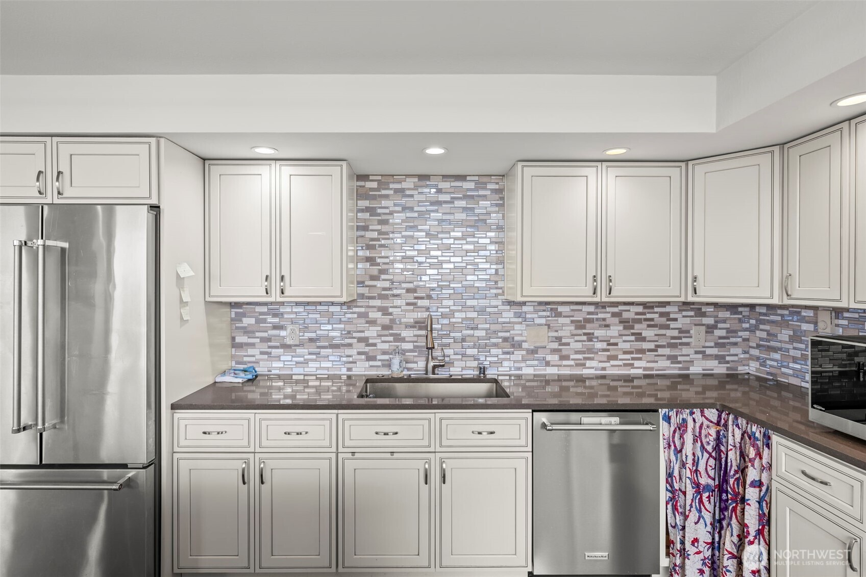 1 North Stadium Way, Unit 2 Tacoma, WA 98403 - Photo 22 of 40 a kitchen with stainless steel appliances granite countertop a refrigerator sink and cabinets