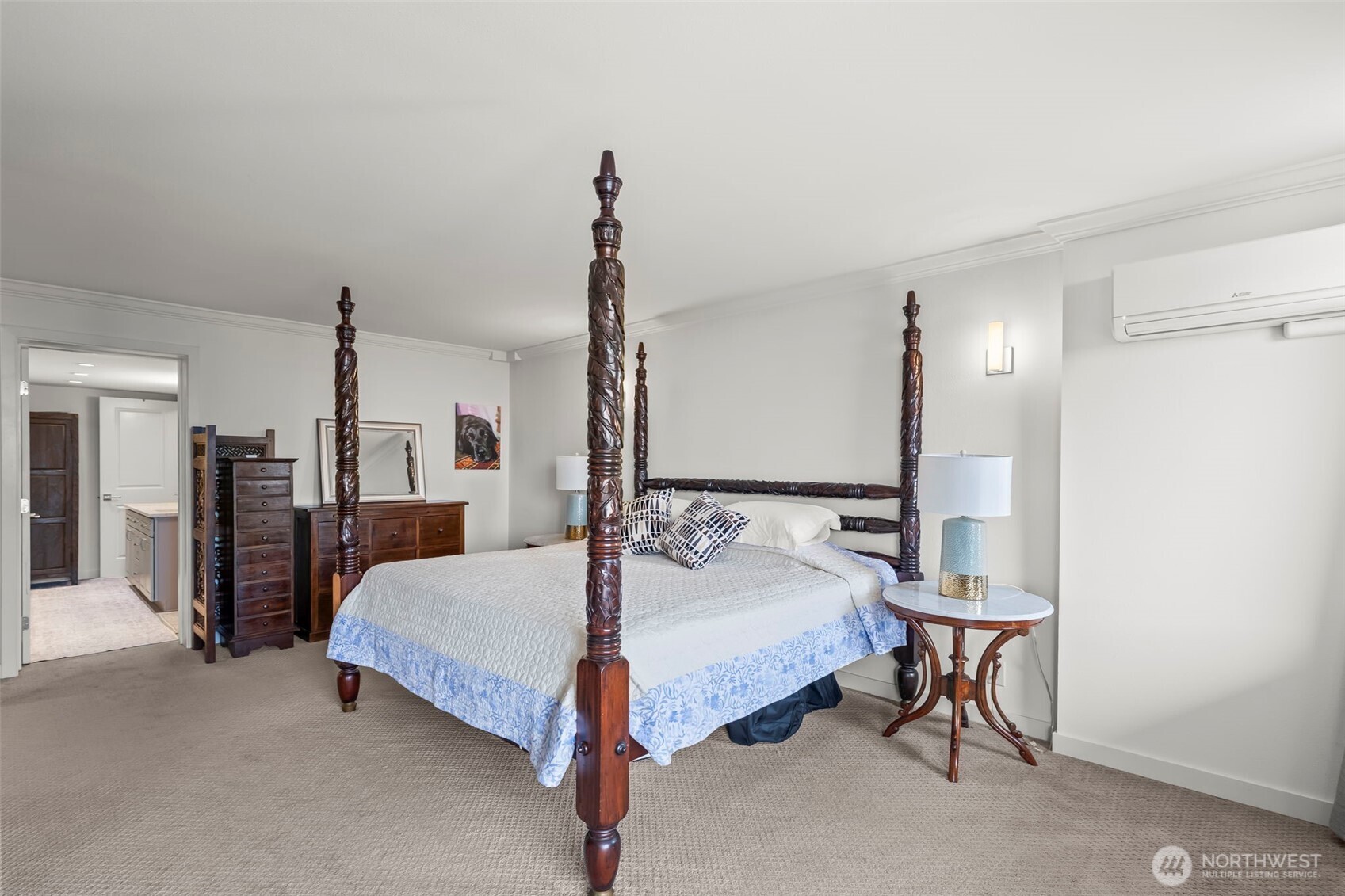 1 North Stadium Way, Unit 2 Tacoma, WA 98403 - Photo 26 of 40 a spacious bedroom with a bed and a chandelier