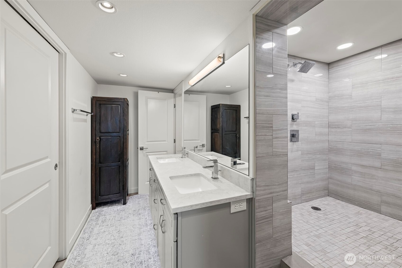 1 North Stadium Way, Unit 2 Tacoma, WA 98403 - Photo 27 of 40 a bathroom with a shower sink and mirror