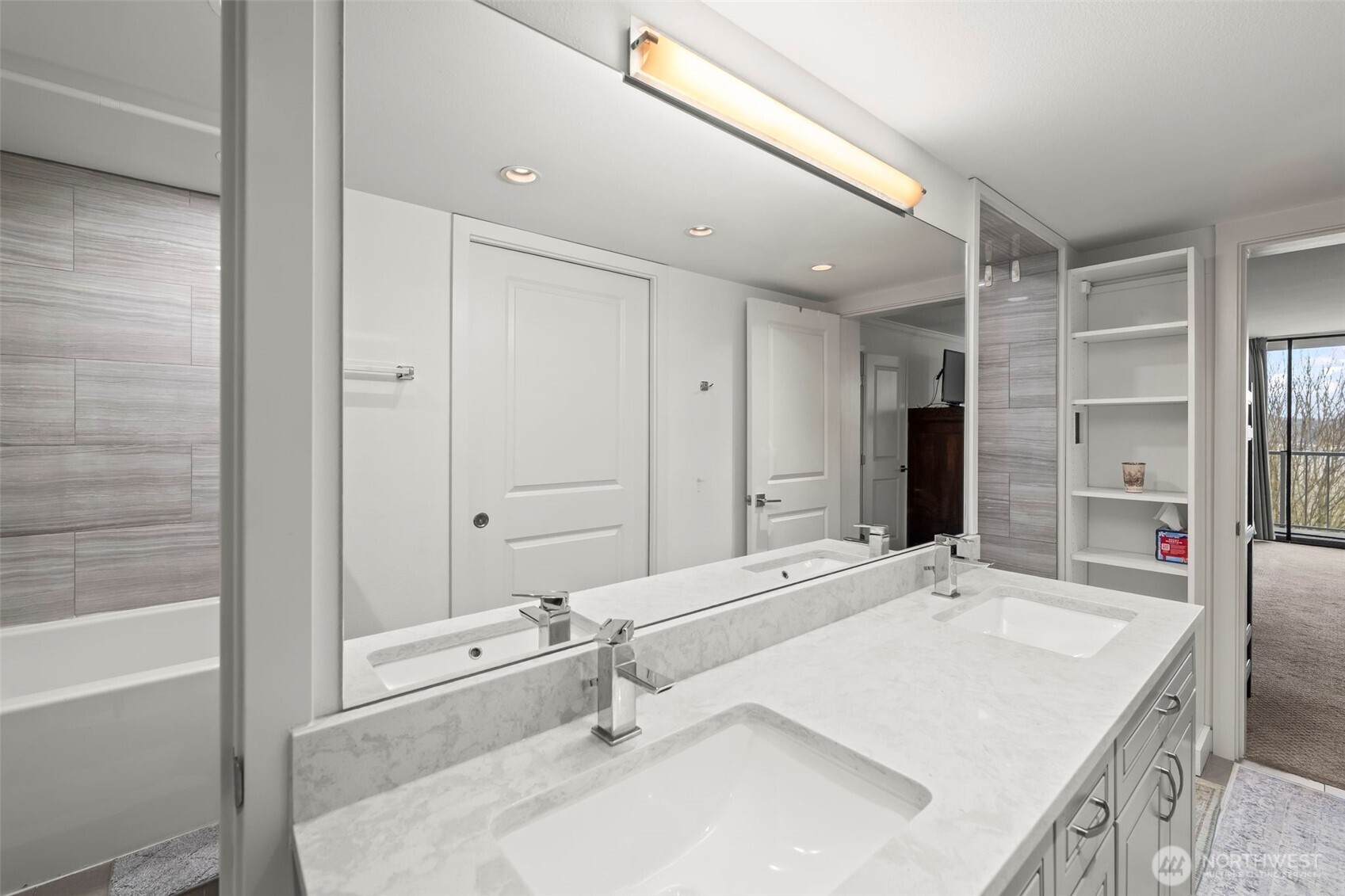 1 North Stadium Way, Unit 2 Tacoma, WA 98403 - Photo 28 of 40 a bathroom with a granite countertop sink a mirror and a bathtub