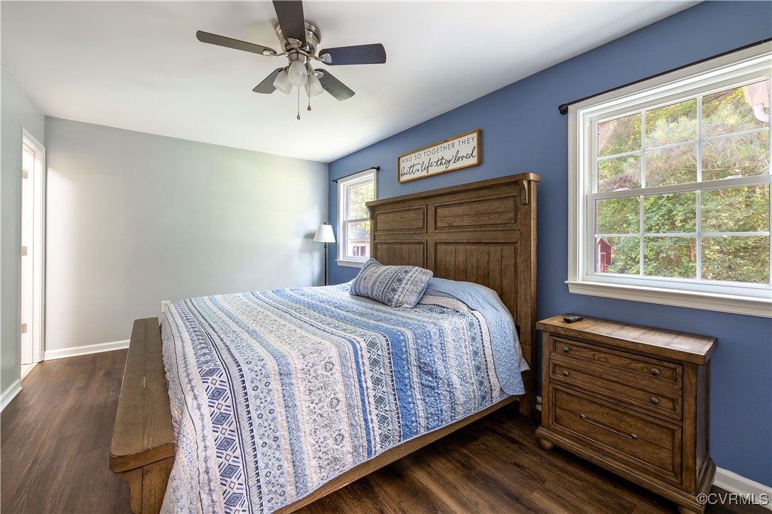 16701 Jolly Road Disputanta, VA 23842 - Photo 20 of 49 Master Bedroom with dark wood-type flooring, ensui
