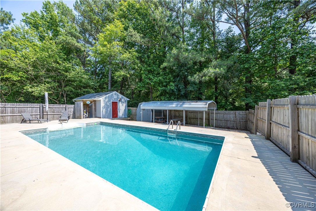 16701 Jolly Road Disputanta, VA 23842 - Photo 29 of 49 View of pool featuring a fenced backyard with gues