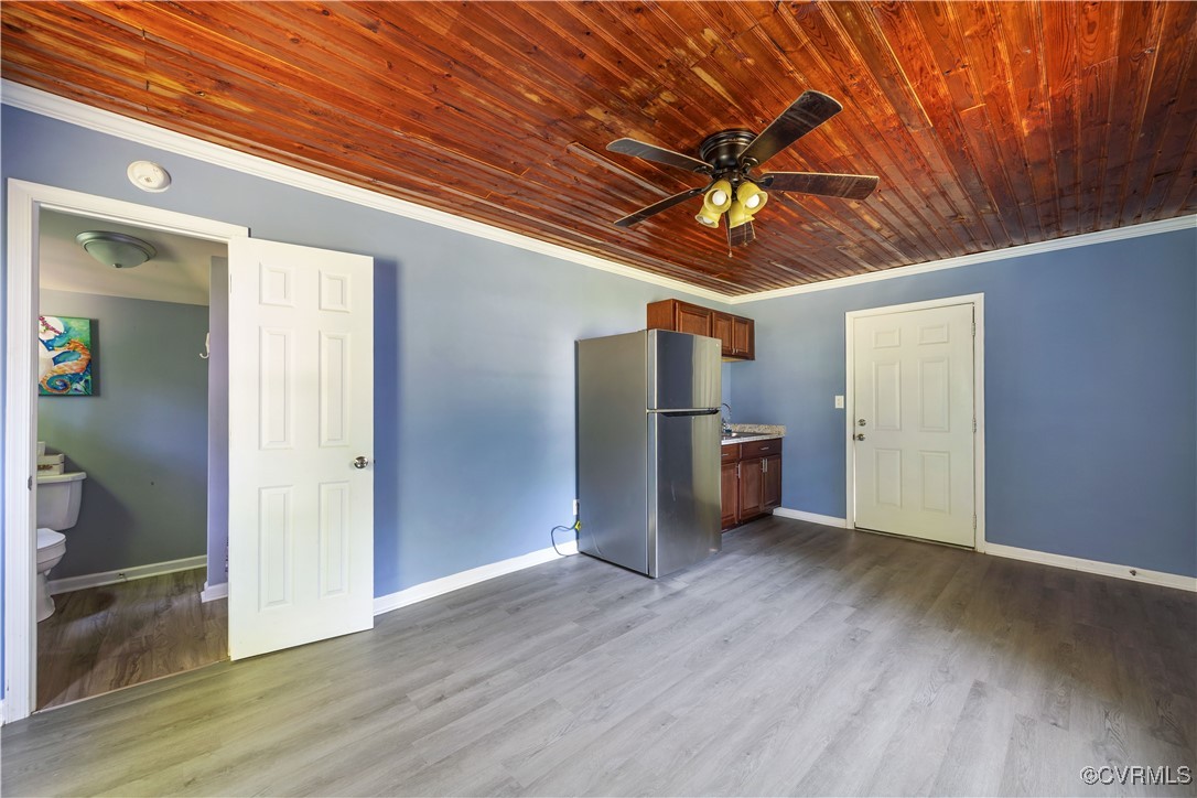 16701 Jolly Road Disputanta, VA 23842 - Photo 32 of 49 Guest/pool cottage with sink, fridge and view into