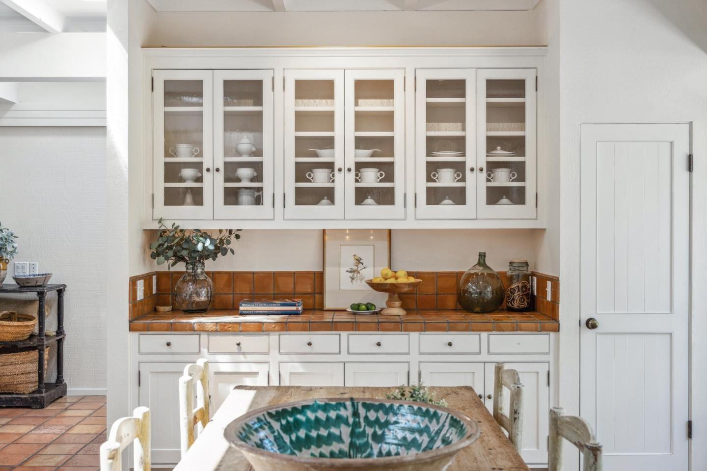 19 Ring Lane Carmel Valley, CA 93924 - Photo 24 of 60 a kitchen with a stove and white cabinets