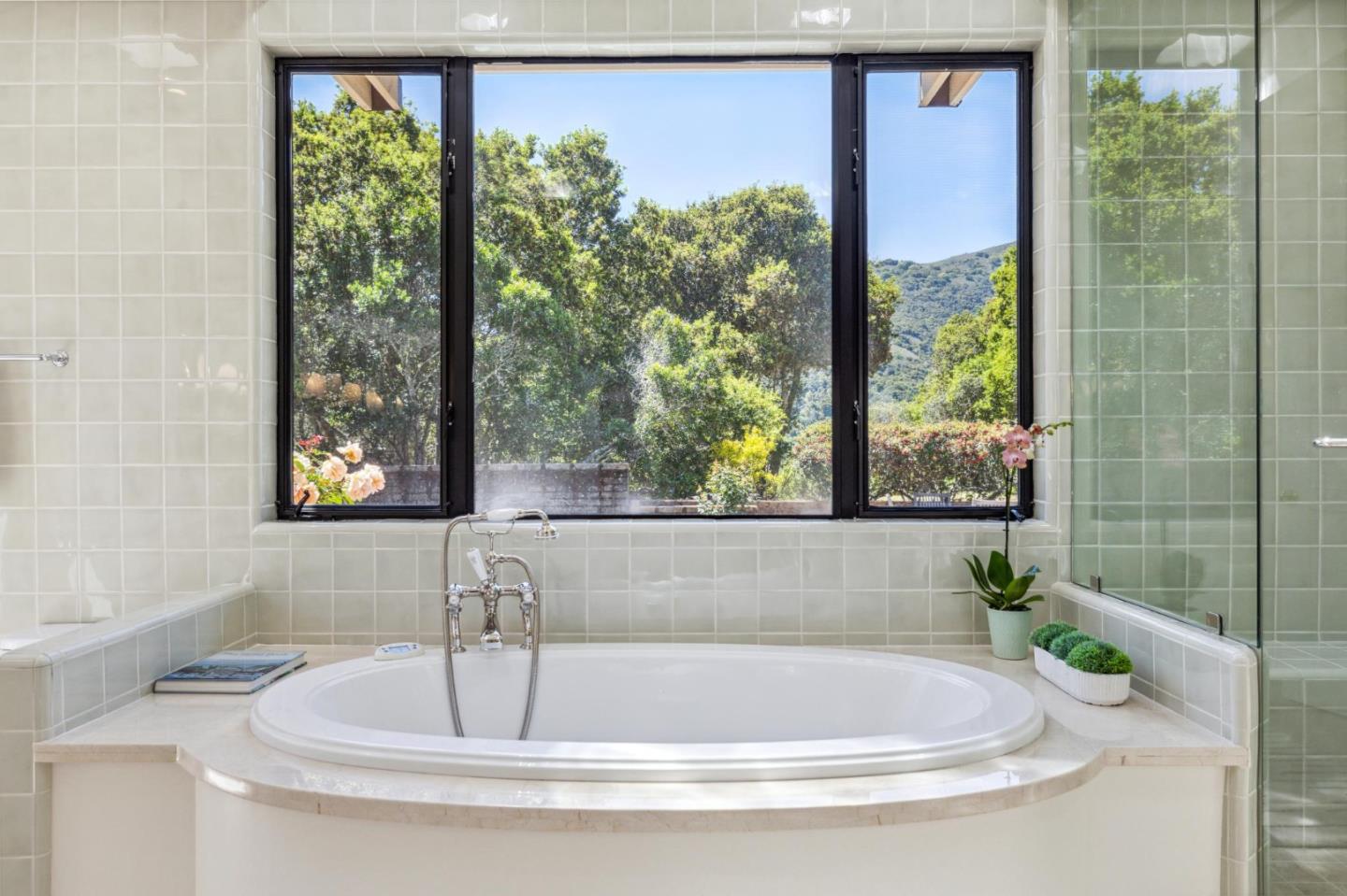 19 Ring Lane Carmel Valley, CA 93924 - Photo 41 of 60 a bath tub sitting in a bathroom next to a window