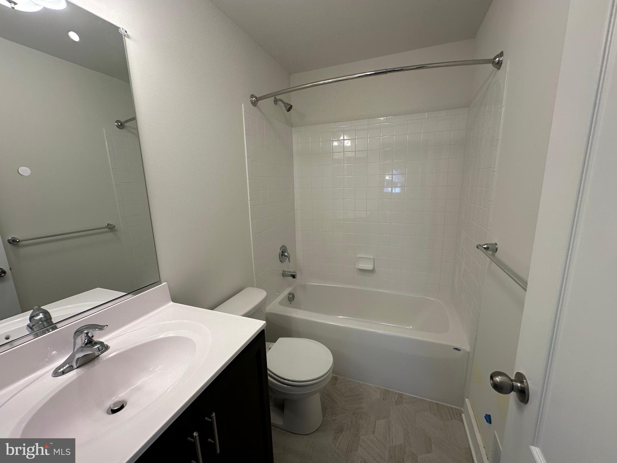 King Avenue Rosedale, MD 21237 - Photo 12 of 29 a bathroom with a sink toilet vanity and shower