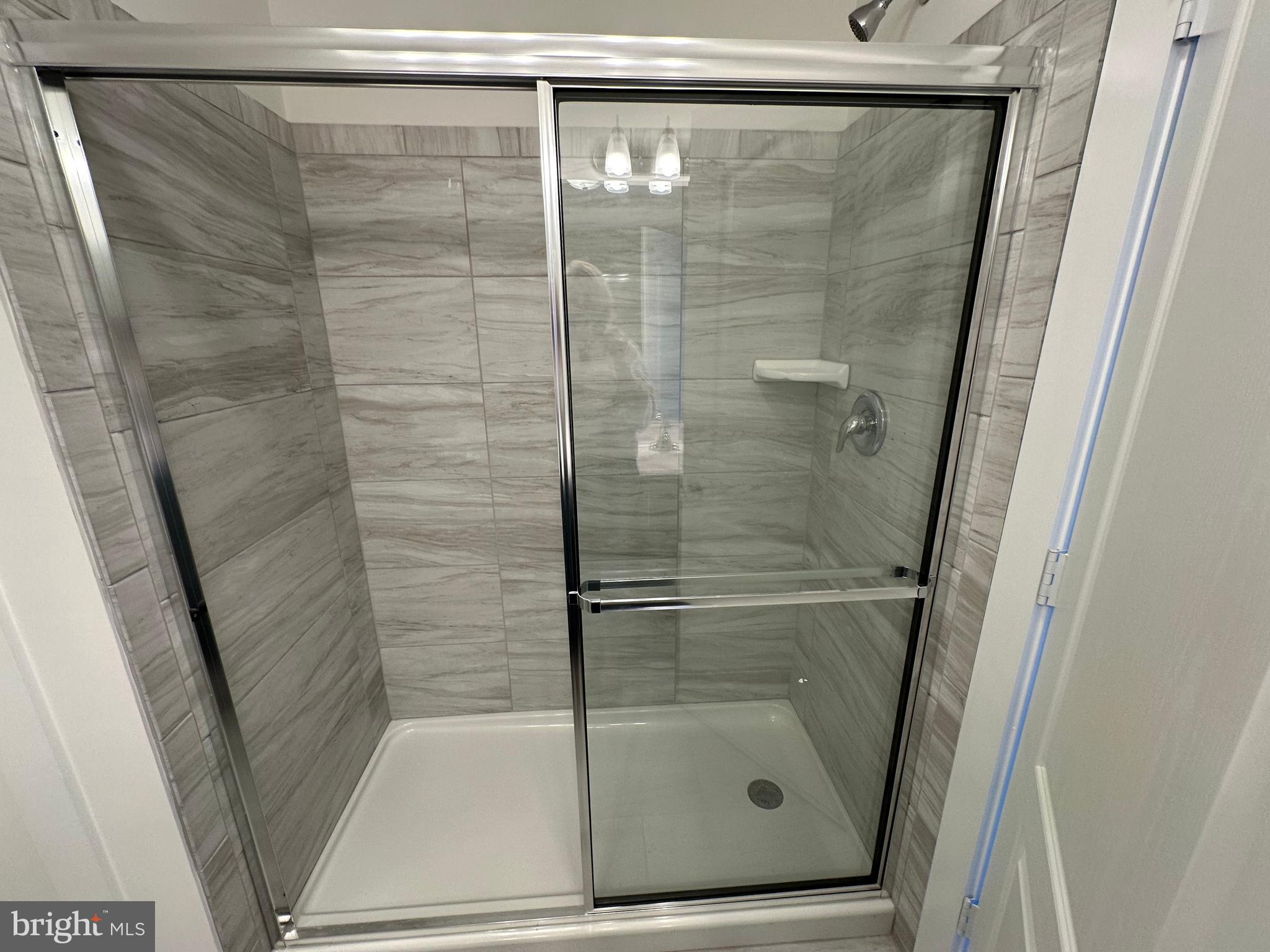 King Avenue Rosedale, MD 21237 - Photo 21 of 29 a bathroom with a glass shower door