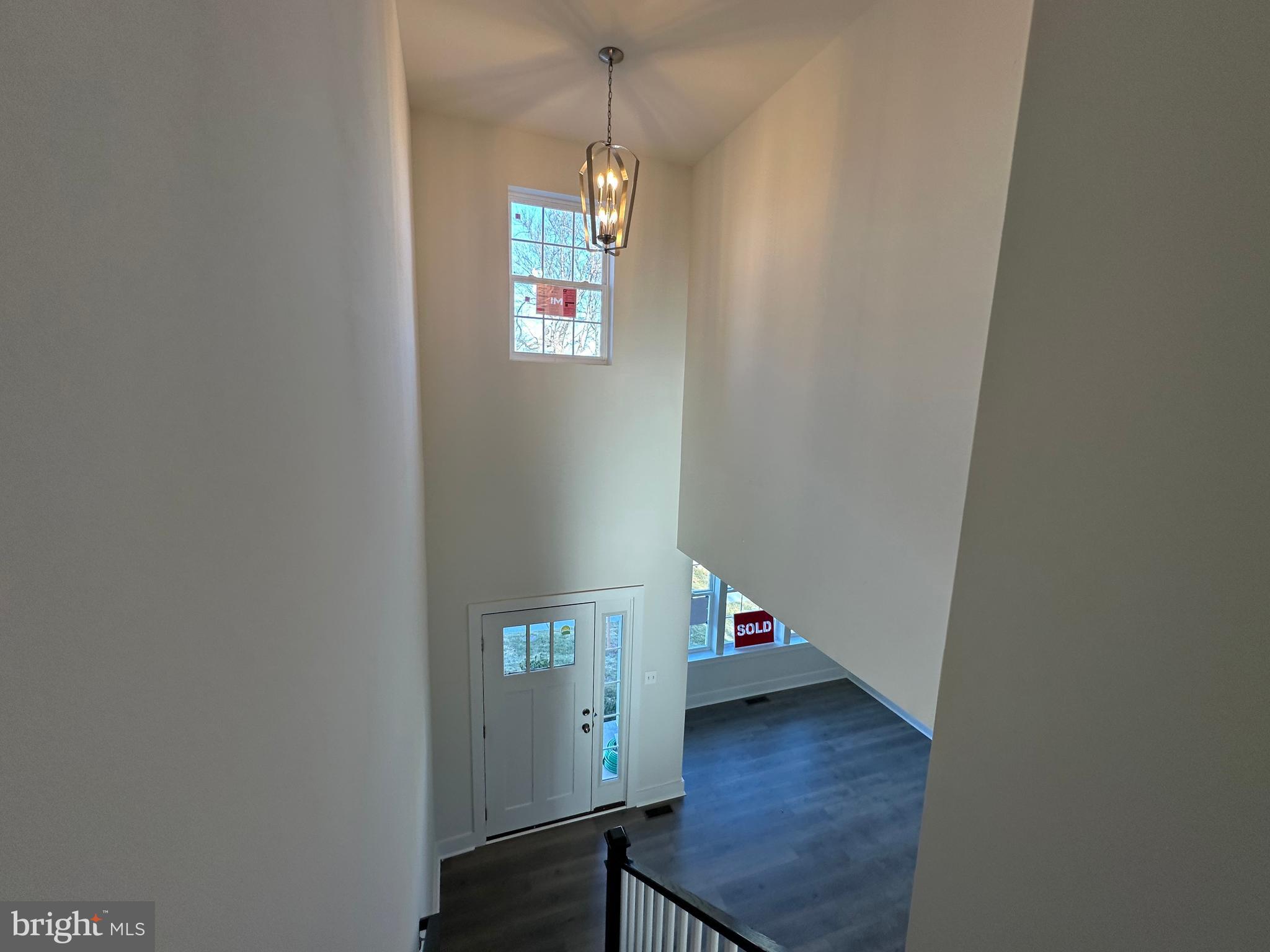 King Avenue Rosedale, MD 21237 - Photo 23 of 29 a view of a hallway with wooden floor and a window