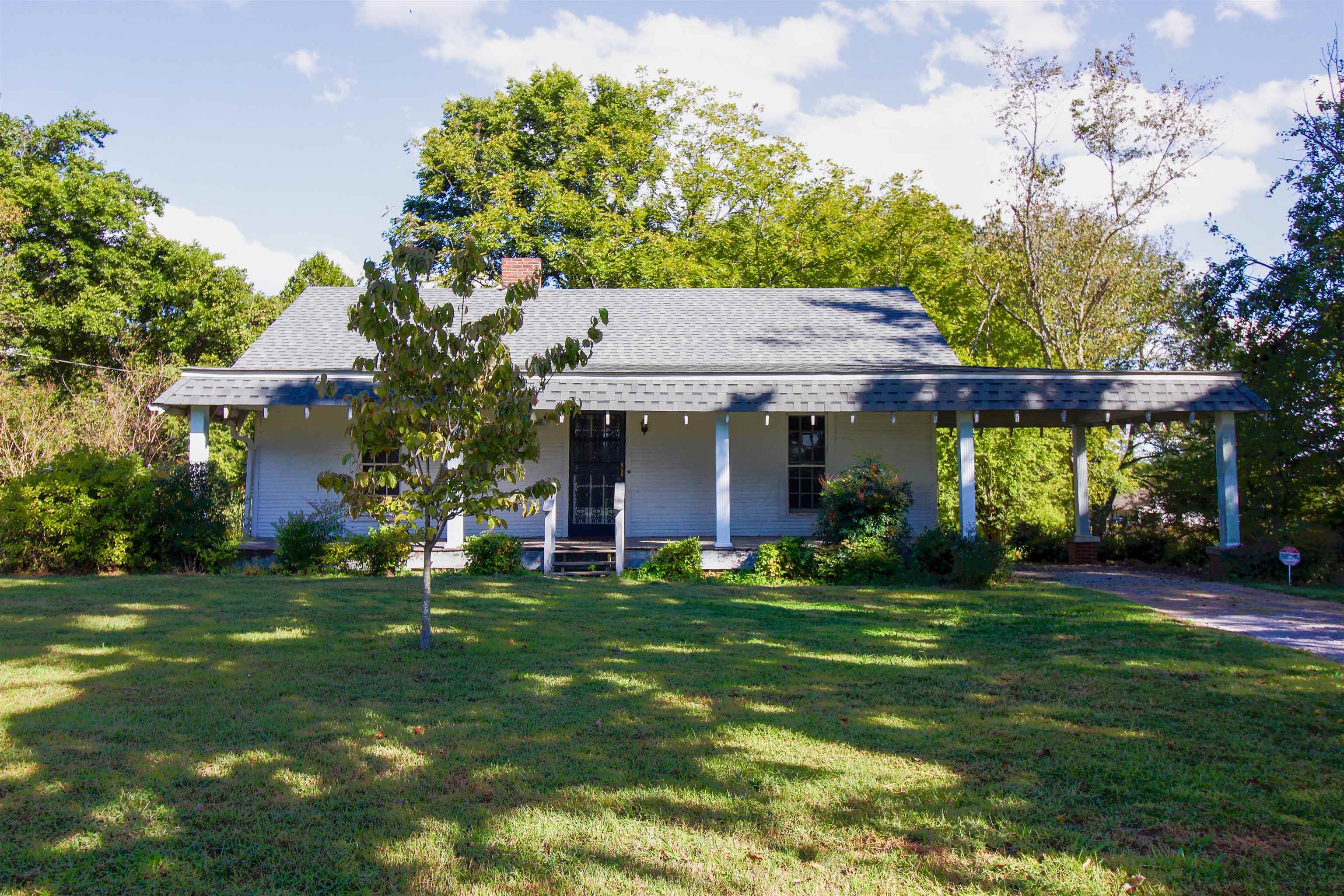 2440 Edith-Nankipoo Road Ripley, TN 38063 - Photo 18 of 27 View of front covered porch, a front yard, a carport, and fruit trees.