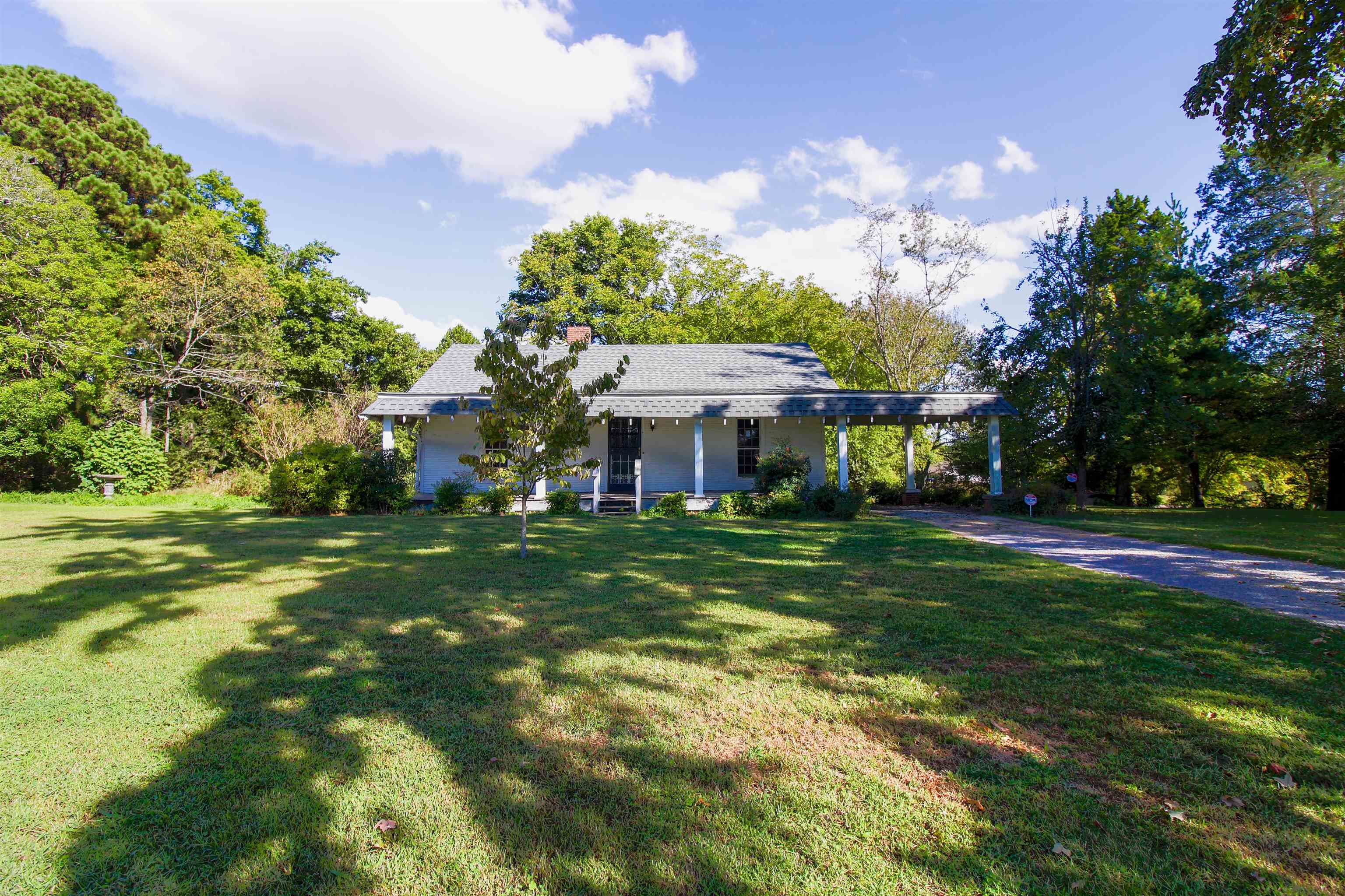 2440 Edith-Nankipoo Road Ripley, TN 38063 - Photo 21 of 27 View of front of home featuring a covered porch, a carport, a front yard, and driveway
