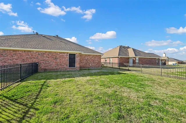 a view of a backyard with a garden