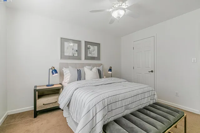 a bed room with a bed and a window