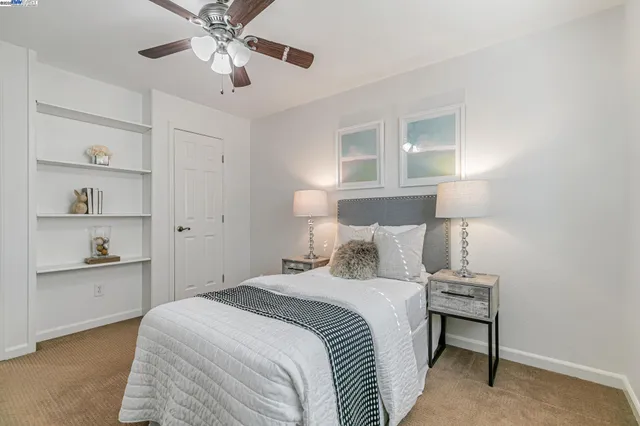 a bathroom with a granite countertop sink a mirror and shower