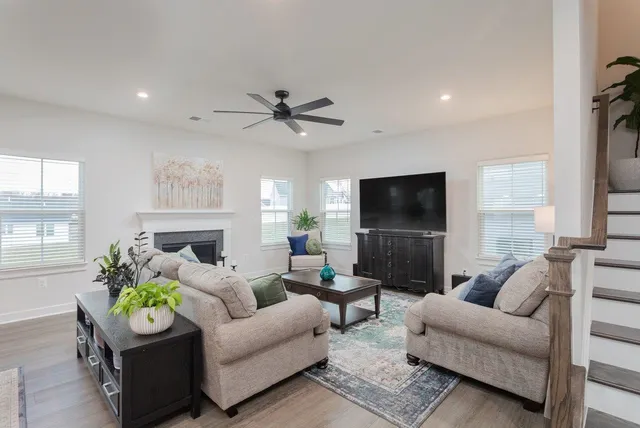 a living room with furniture and a fireplace