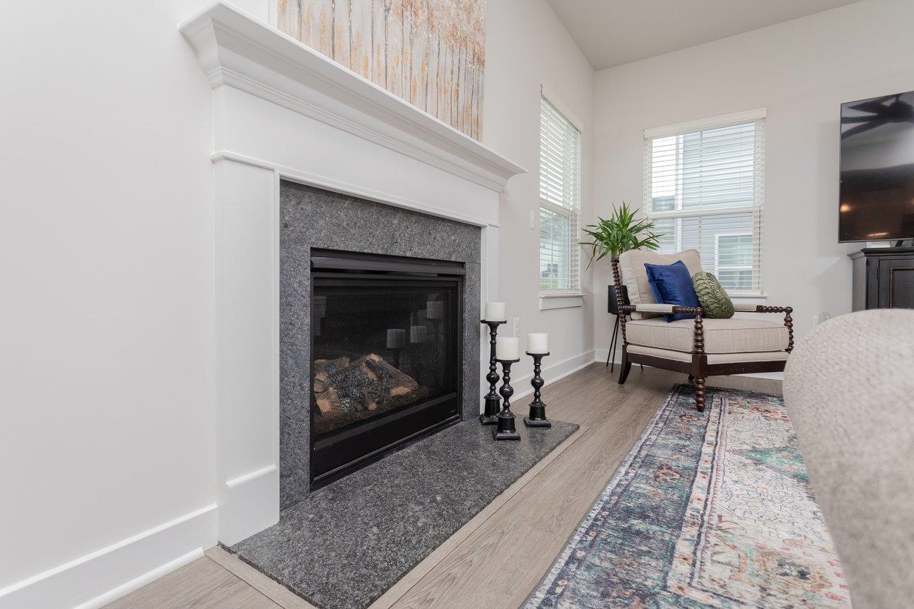 2754 Rdg Hvn Drive Harrisonburg, VA 22801 - Photo 14 of 64 a living room with furniture a flat screen tv and a fireplace