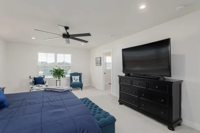 a bathroom with a granite countertop sink a vanity and a window