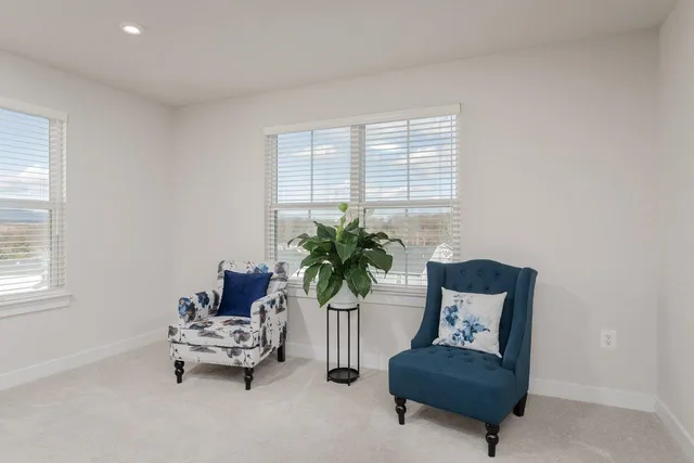 a bathroom with a sink and mirror with window