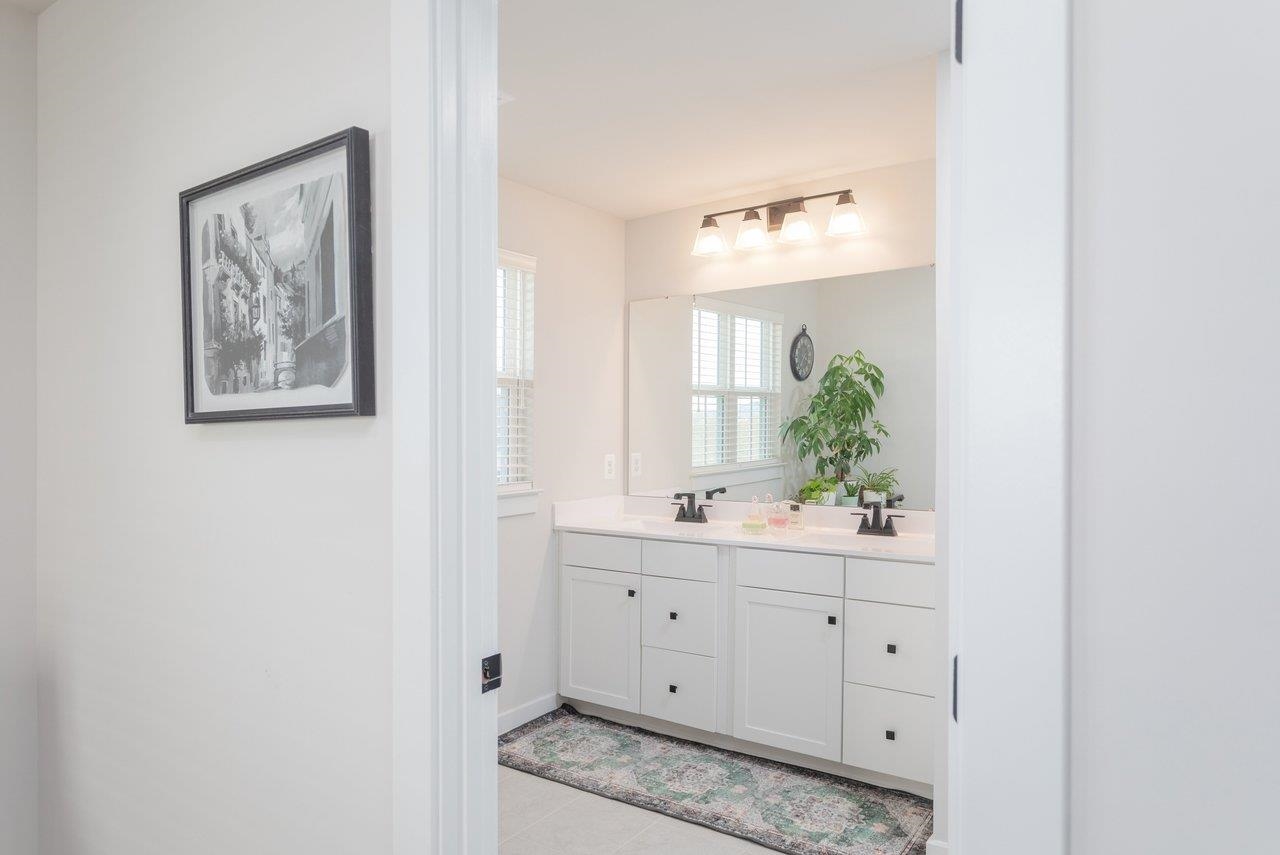 2754 Rdg Hvn Drive Harrisonburg, VA 22801 - Photo 35 of 64 a bathroom with a granite countertop sink a vanity and a window