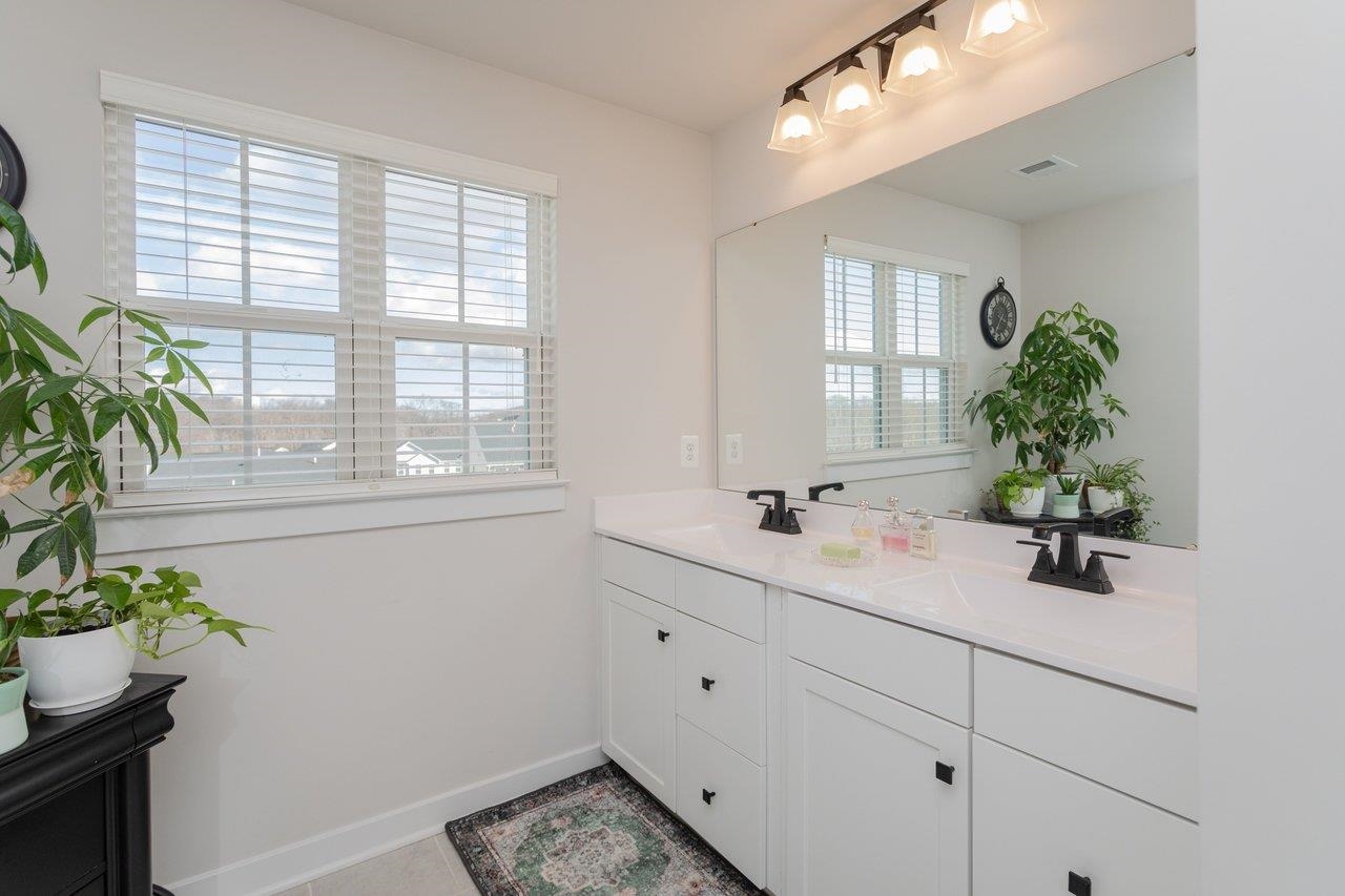 2754 Rdg Hvn Drive Harrisonburg, VA 22801 - Photo 36 of 64 a bathroom with a sink and mirror with window