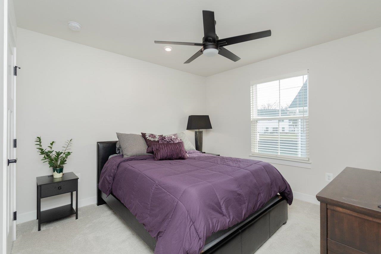 2754 Rdg Hvn Drive Harrisonburg, VA 22801 - Photo 39 of 64 a bedroom with a bed chandelier and a window