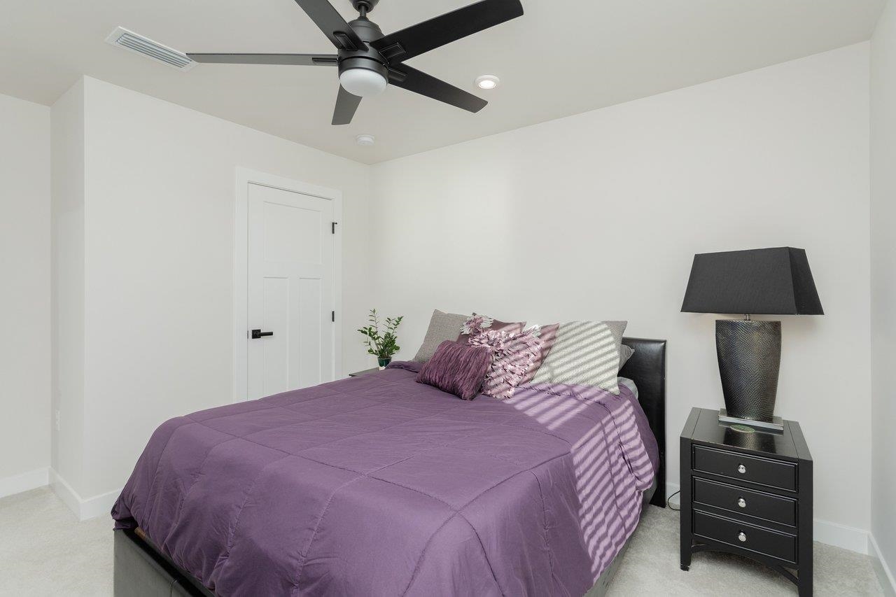 2754 Rdg Hvn Drive Harrisonburg, VA 22801 - Photo 40 of 64 a bedroom with a bed and a lamp on the dresser
