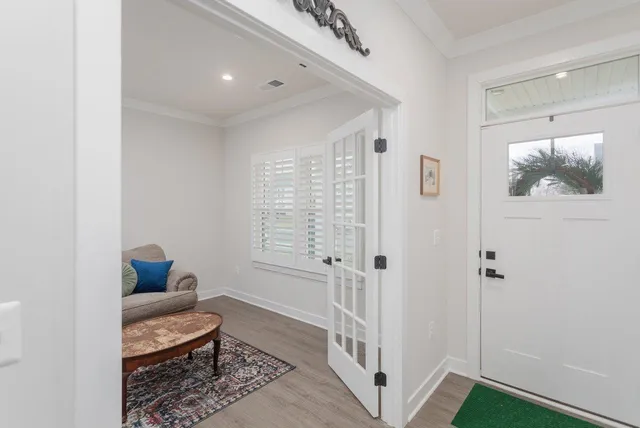 a living room with furniture and a rug