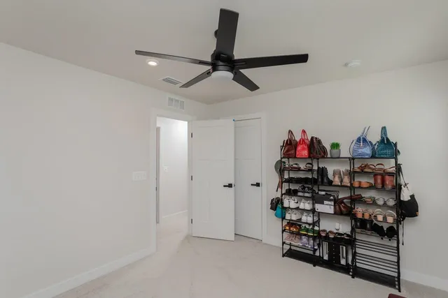 a view of a porch with a table and chairs