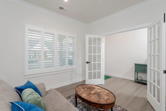 a view of a livingroom with furniture and a flat screen tv