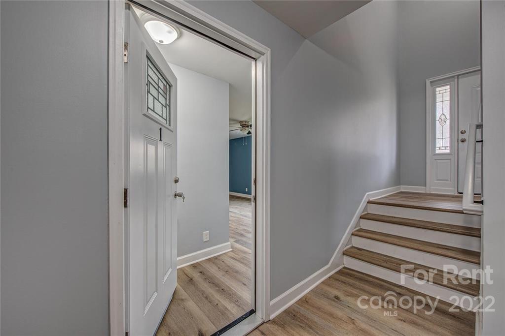 1048 Avondale Road, Unit 14 Lowell, NC 28098 - Photo 2 of 11 a view of a hallway with entryway and wooden floor