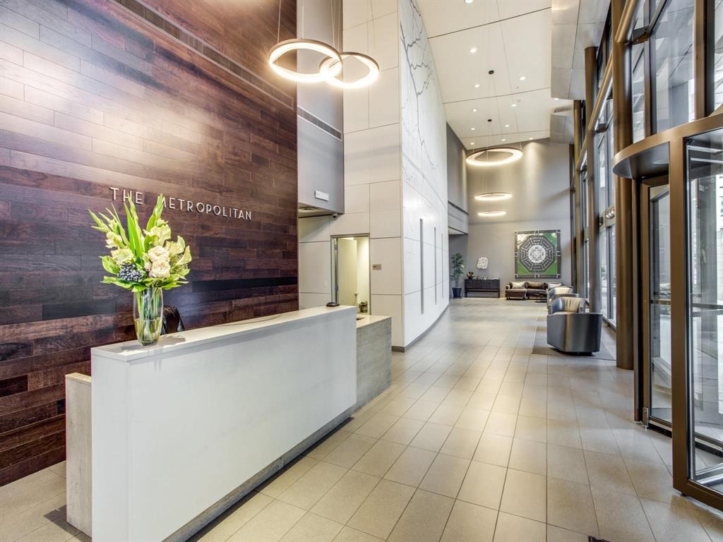 1200 Main Street, Unit 408 Dallas, TX 75202 - Photo 2 of 5 a lobby with furniture and a potted plant