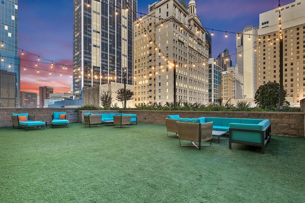 1200 Main Street, Unit 408 Dallas, TX 75202 - Photo 5 of 5 a backyard of a building with outdoor seating and green space