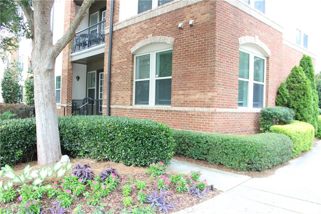 901 Abernathy Road Northeast, Unit 2110 Sandy Springs, GA 30328 - Photo 20 of 29 a view of a house with a yard
