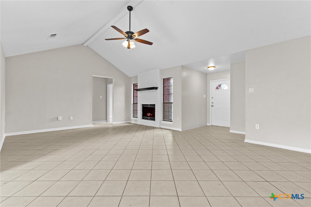 180 County Road 4933 Kempner, TX 76539 - Photo 4 of 24 a view of an empty room with a fireplace