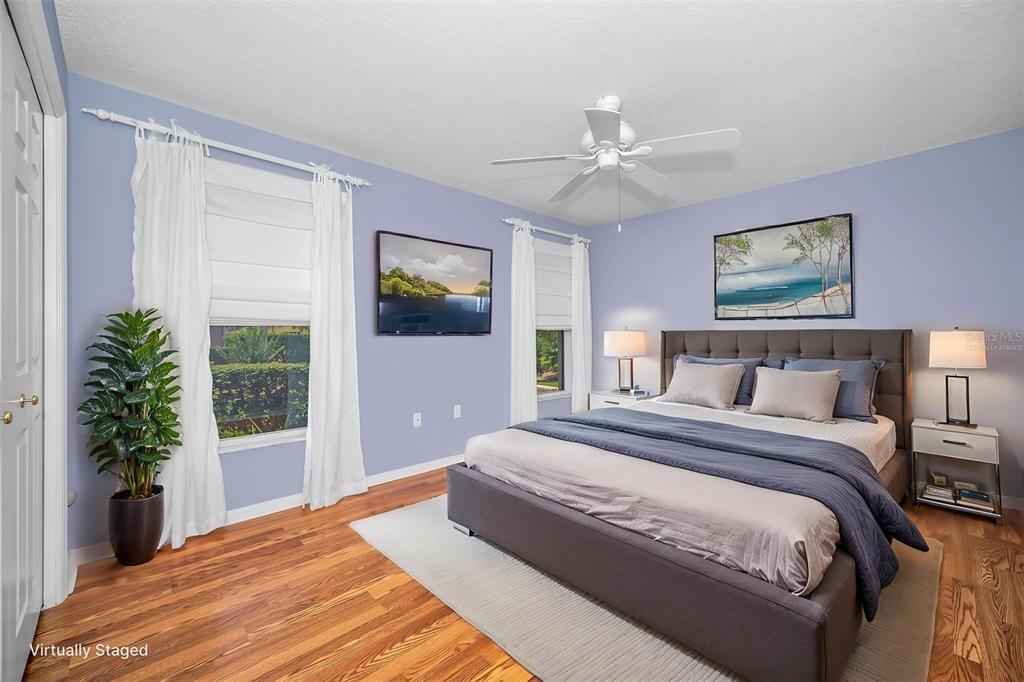 11917 Hadleigh Way Trinity, FL 34655 - Photo 34 of 84 a bedroom with a large bed and a window