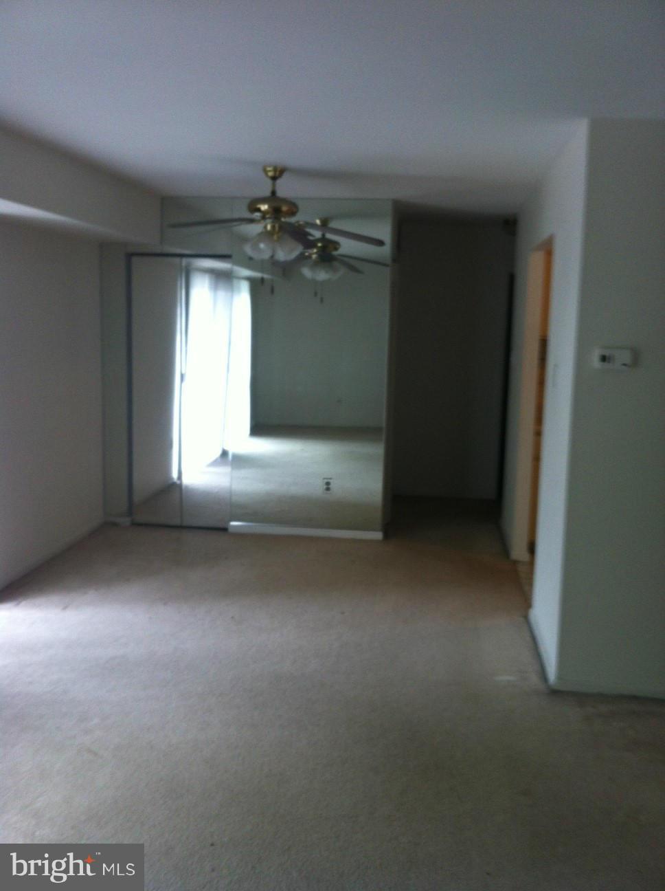 6147 Edsall Road, Unit H Alexandria, VA 22304 - Photo 2 of 13 a view of an empty room with a window