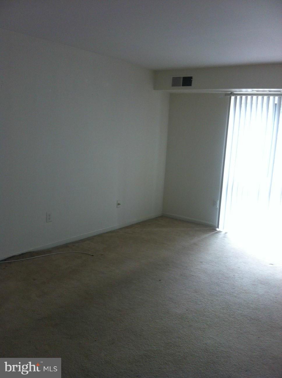 6147 Edsall Road, Unit H Alexandria, VA 22304 - Photo 3 of 13 a view of an empty room and a window