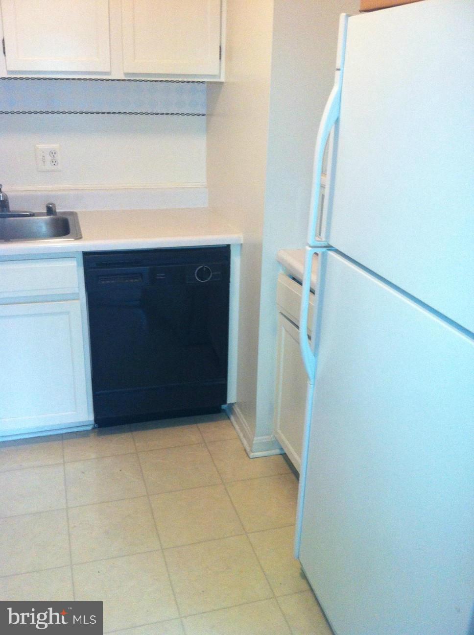 6147 Edsall Road, Unit H Alexandria, VA 22304 - Photo 7 of 13 a kitchen with a cabinets and a sink