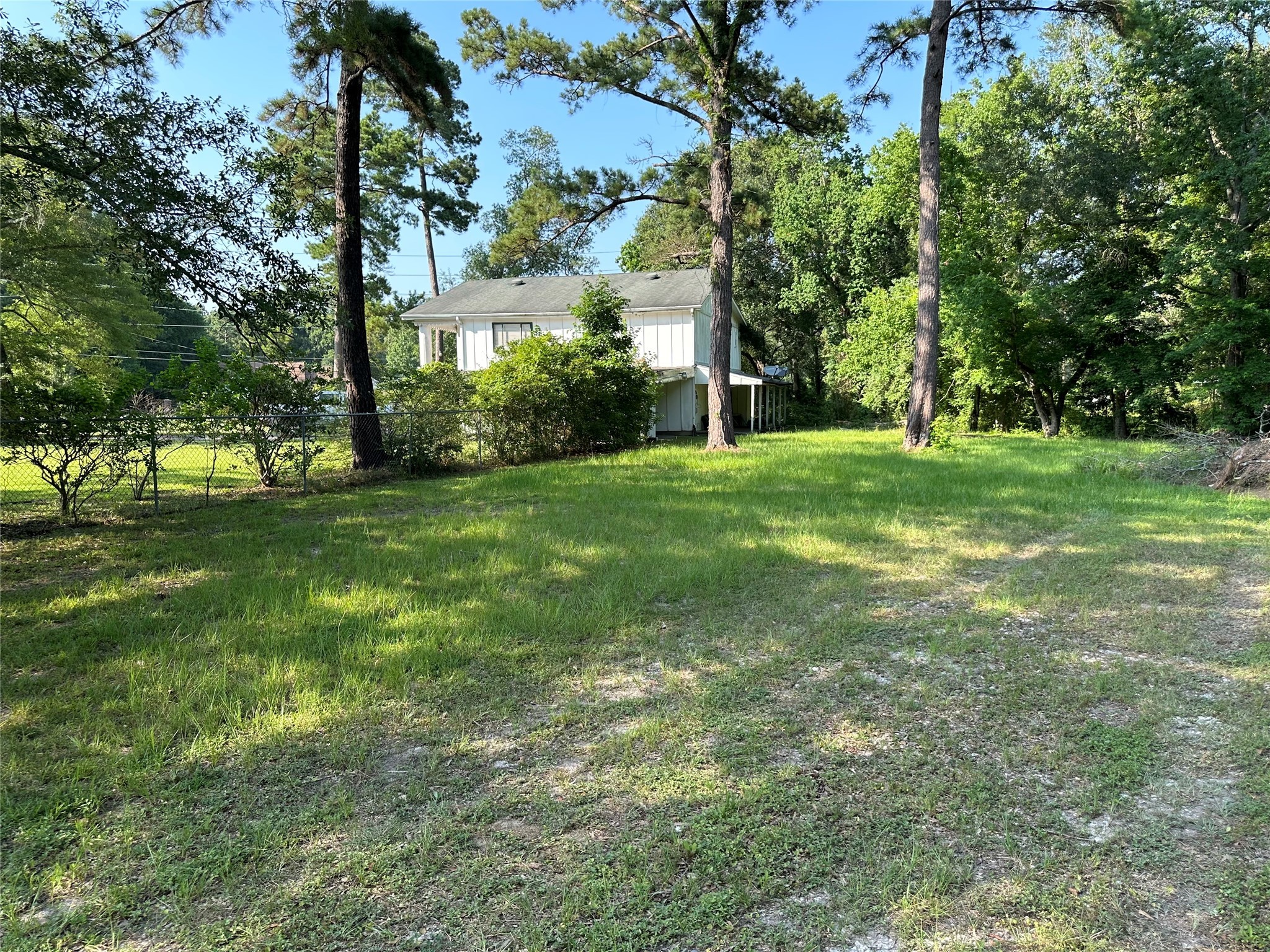 15361 Westgate Road Splendora, TX 77372 - Photo 12 of 18 a view of a trees with a big yard