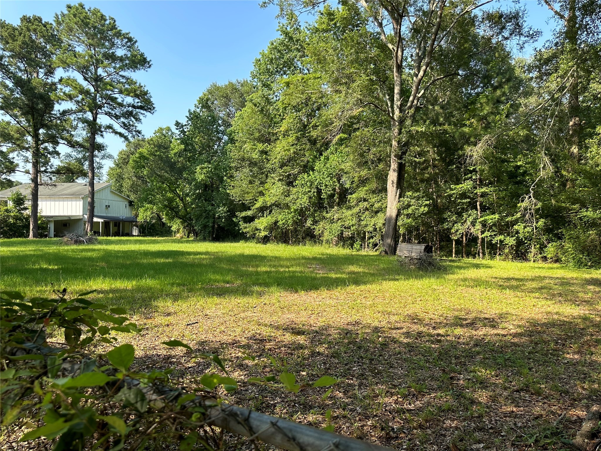 15361 Westgate Road Splendora, TX 77372 - Photo 16 of 18 a view of a golf course with a lake