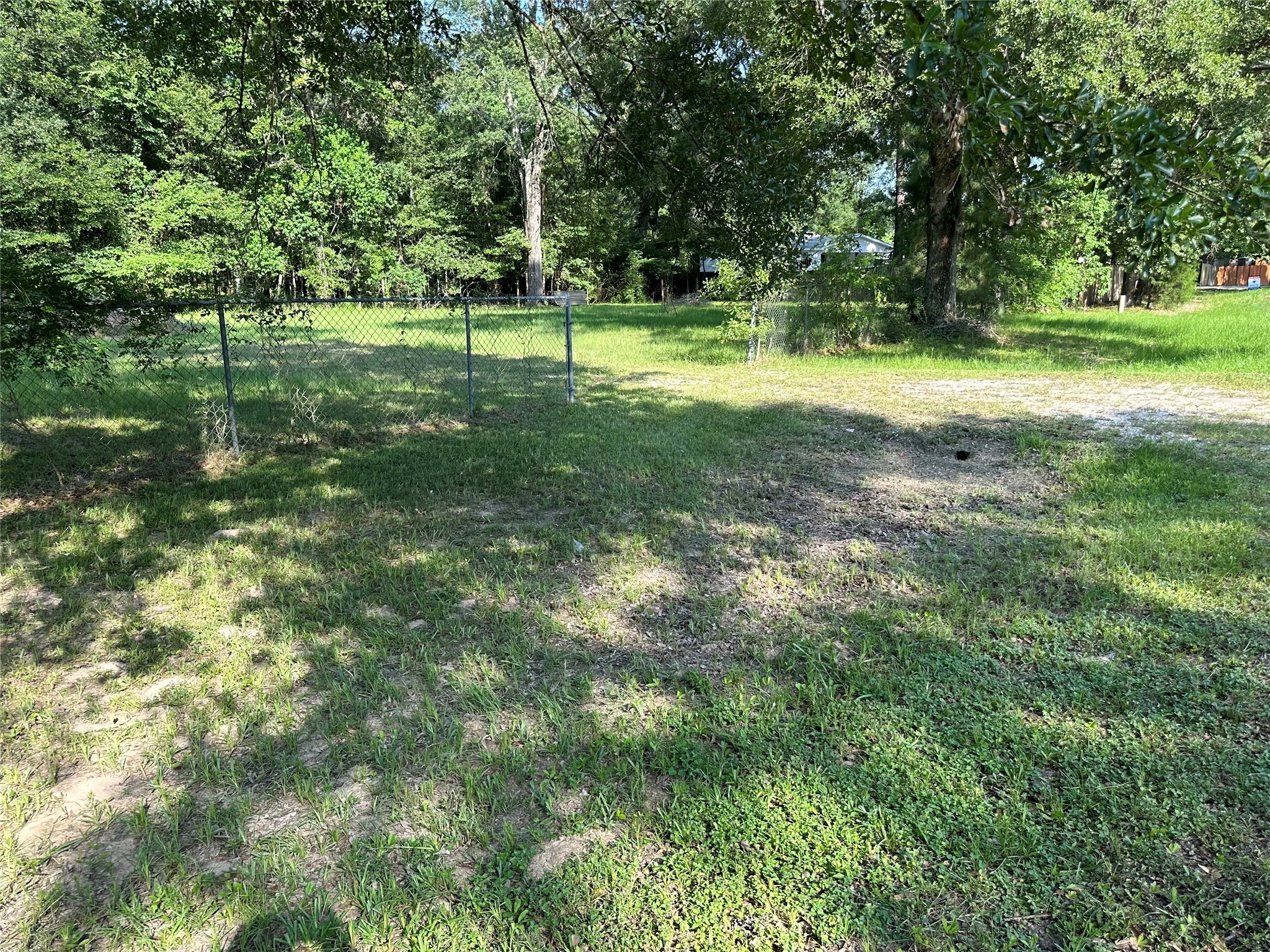 15361 Westgate Road Splendora, TX 77372 - Photo 17 of 18 a view of a park with large trees