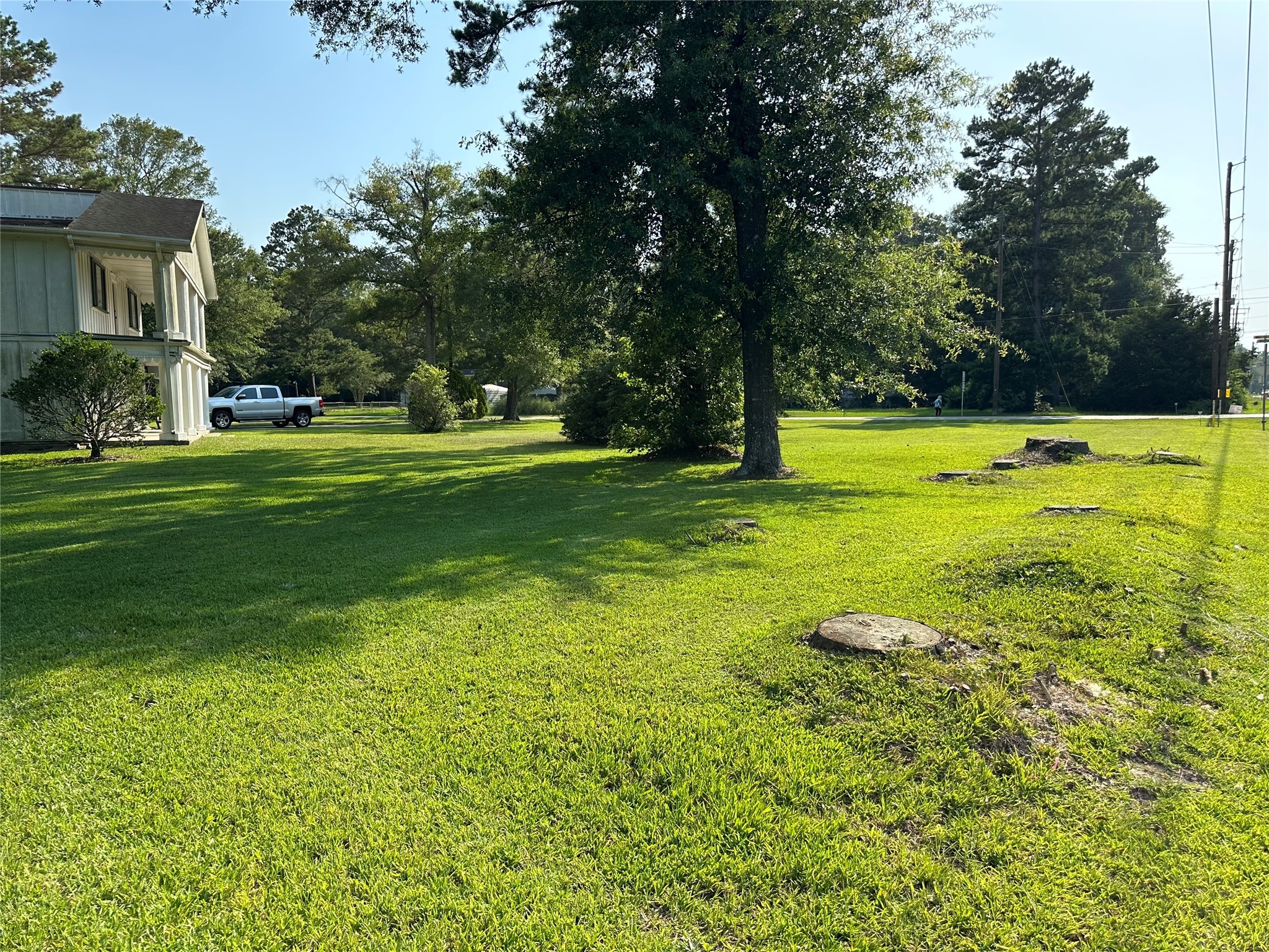 15361 Westgate Road Splendora, TX 77372 - Photo 2 of 18 a view of a house with a big yard