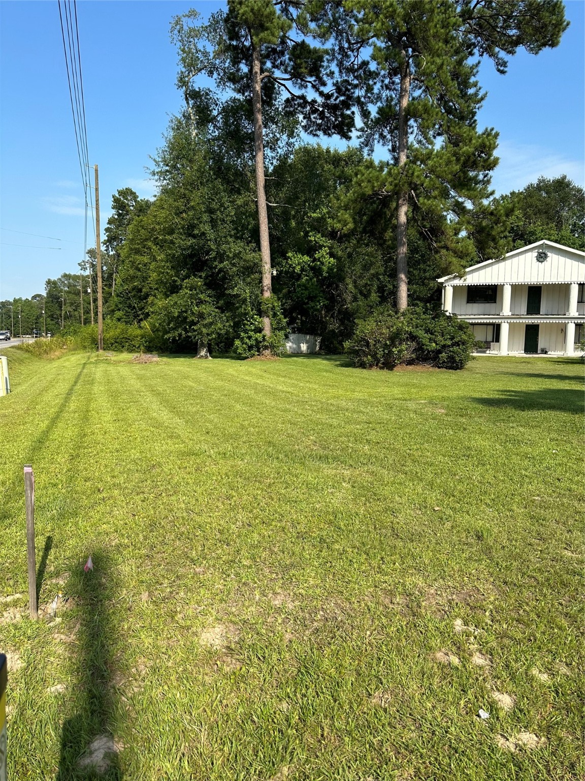 15361 Westgate Road Splendora, TX 77372 - Photo 3 of 18 a front view of a house with a yard