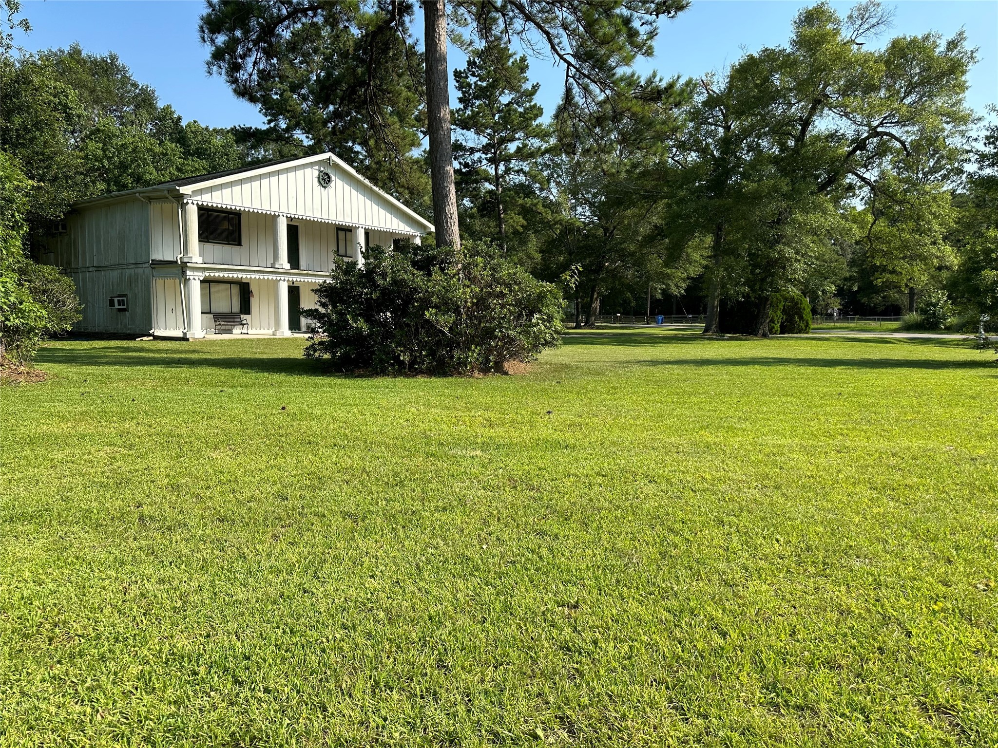 15361 Westgate Road Splendora, TX 77372 - Photo 5 of 18 a front view of a house with a garden