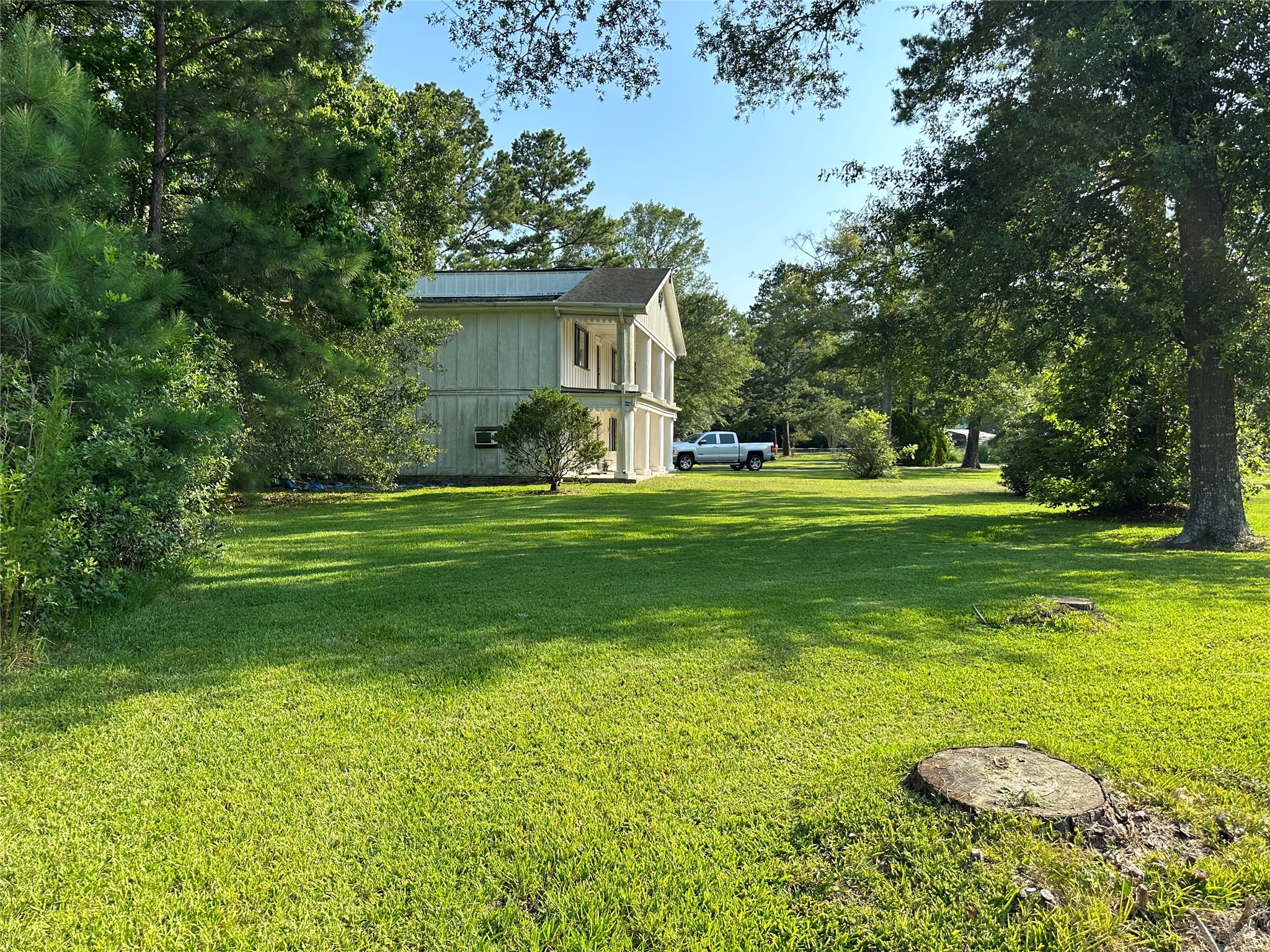 15361 Westgate Road Splendora, TX 77372 - Photo 6 of 18 a view of a house with a backyard
