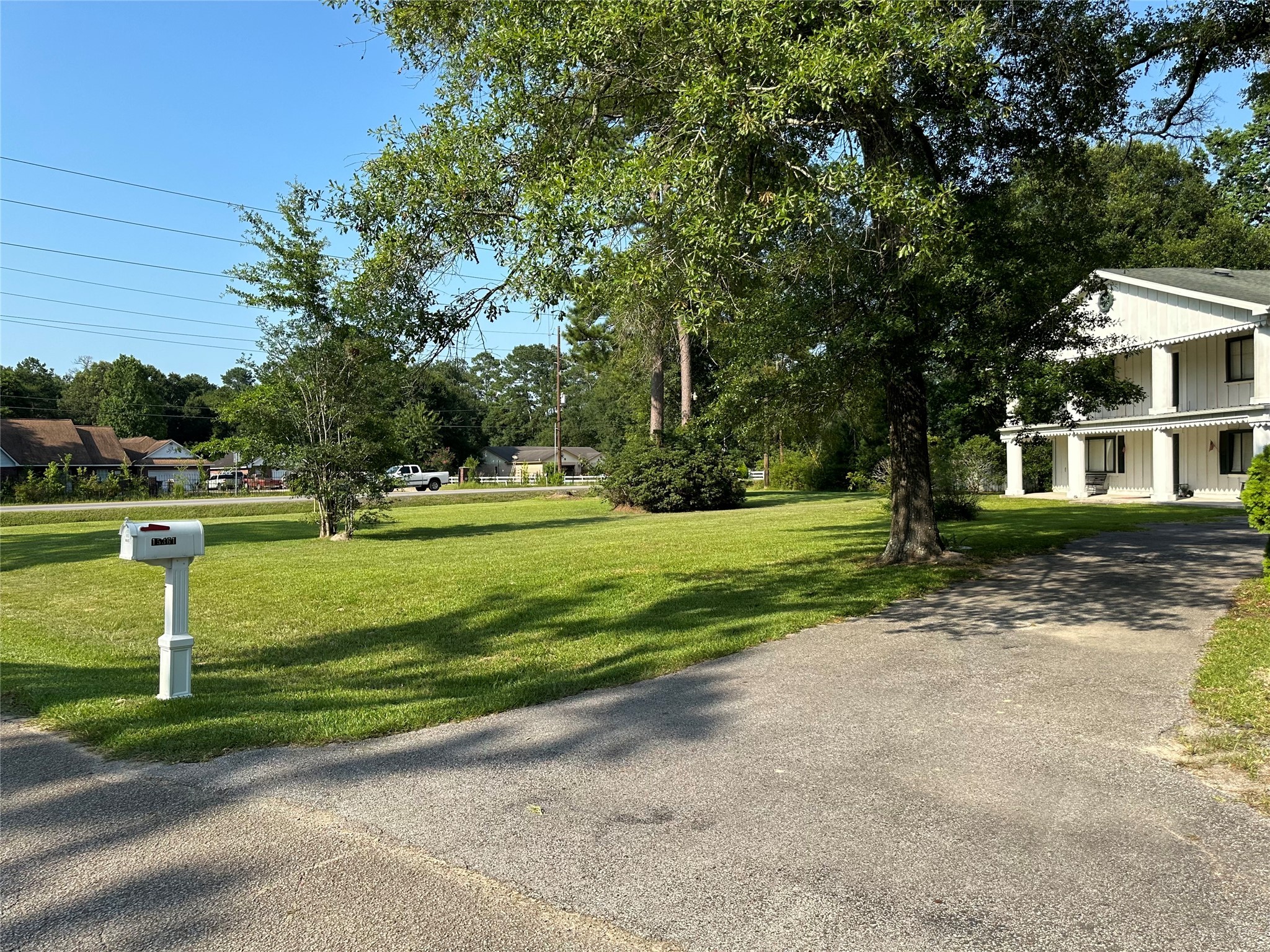 15361 Westgate Road Splendora, TX 77372 - Photo 7 of 18 a front view of a house with a yard