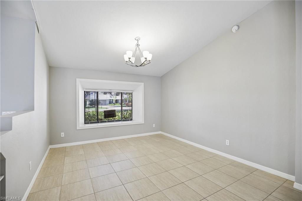 1937 Princess Court Naples, FL 34110 - Photo 16 of 42 an empty room with a window